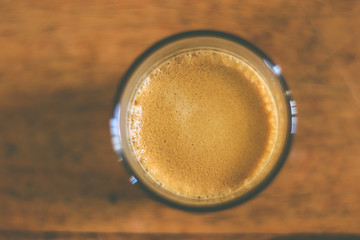 cup of coffee on a wooden table