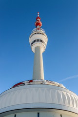 Obraz premium Eastern Sudetes, Praded Relay station on the top of the mountain, against the blue sky.