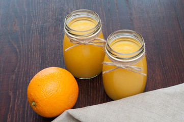Orange juice in rustic style jars