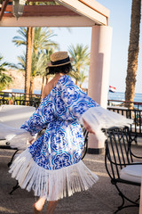 woman near pool in maiolica dress