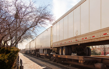 Fototapeta premium Blank train car passing by. Great for mocking up logos and advertising.