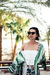 woman looking forward in tropical beach