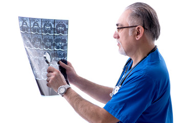 White bearded old doctor radiologist working in clinic 