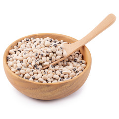 Black-eyed peas in a wooden bowl isolated on a white background