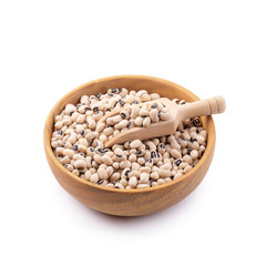 Black-eyed peas in a wooden bowl isolated on a white background