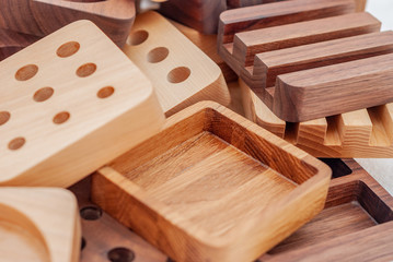 Assortment of wood handcraft pieces on white background