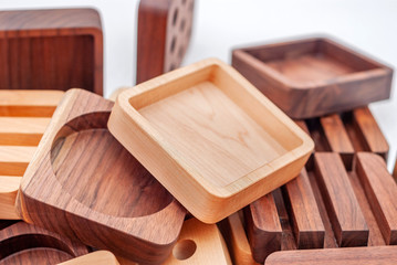 Assortment of wood handcraft pieces on white background