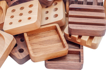 Assortment of wood handcraft pieces on white background