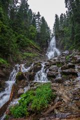 Fototapeta na wymiar large rohache waterfall in spring. slovakia