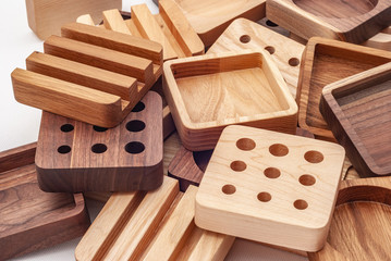 Assortment of wood handcraft pieces on white background