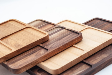 Shaped wooden boards in row on white background