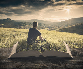 Man enjoy the valley on the pages of book, vintage