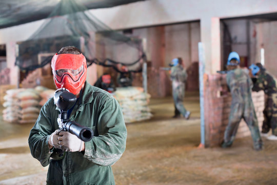 Player in red mask in paintball club