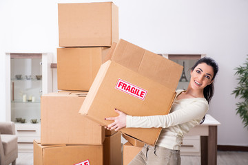 Young woman moving to new flat 