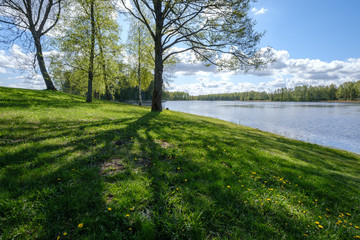 recreation camping area by the blue lake in sunny summer day