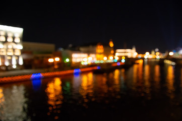 Abstract city lights background. Defocused urban background at night