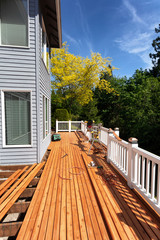 Outdoor wooden deck being completely remodeled during springtime