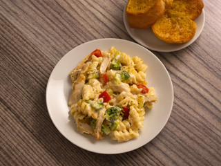 Pasta Primavera with Chicken Slices in White Sauce and a side of Toasted Garlic Bread 