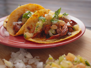 Soft Tortilla Tacos with Spicy Sauce and Tomato Onion and Cilantro 