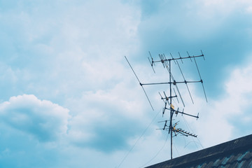 televisions antennas with sunset cloudy sky background