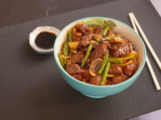 Bowl of Asian Food Style Angus Meat with Vegetables and Soy Sauce 