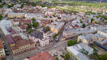 Aerial summer view of central part of beautiful ancient ukrainian city Chernivtsi with its streets, old residential buildings, town hall, churches etc. Beautiful town. UNESCO world heritage site.