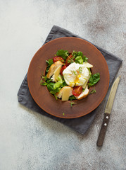 Rustic vegetable and chicken salad with poached egg