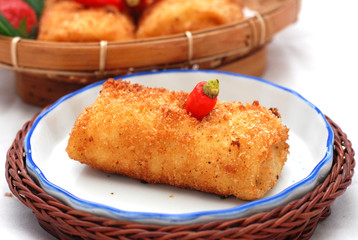 Fried brown mayonnaise cake with a long, coarse-textured shape