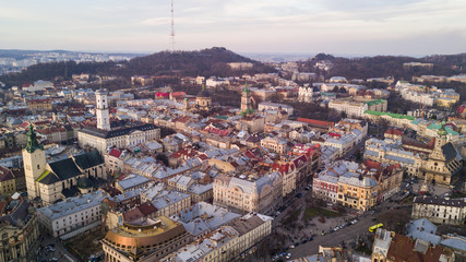 Rooftops of the old town in Lviv in Ukraine during the day. The magical atmosphere of the European city. Landmark, the city hall and the main square. Aerial view.