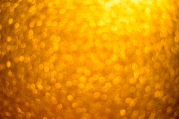 Gold glitter christmas abstract background. Defocused sequin light.