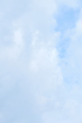 Blue sky with white clouds background texture. Copy space.