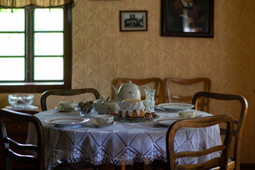 Kitchen utensils in the interior of old traditional rural wooden house.