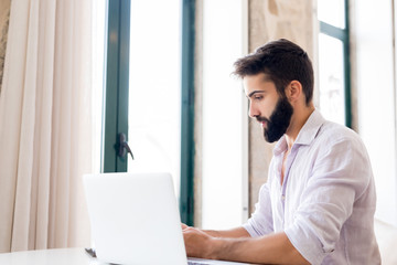 Man working on laptop from home