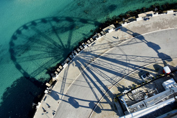 Beautiful landscape and panorama with the view of Adriatic sea , lungomare Bari and wheel's shadow , Pugia region , Italy. 