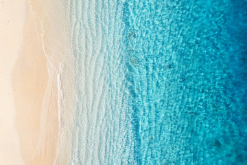 Beach and ocean as a background from top view. Azure water background from top view. Summer...