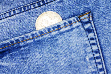 coin cryptocurrency bitcoin in your jeans pocket. bitcoin the most Popular cryptocurrency in the world. Toned image