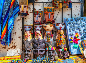 Masks and souvenirs sale in Chinchero street of Urubamba Province in Peru.