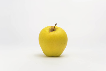 Yellow apple on white background.