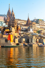 India, Varanasi, 27 Mar 2019 - A view of the ghats Ratneshwar Mahadev, Manikarnika Ghat and Scindia Ghat in Varanasi, during early sunrise, taken from a boat in the Ganges River