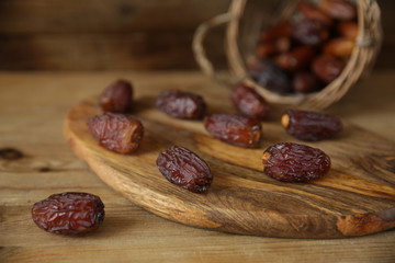 dates in a basket on wooden natural background