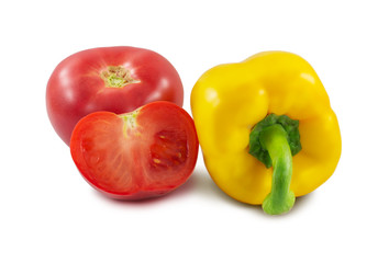 yellow pepper and tomato are isolated on a white background