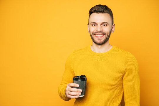 Smiling Young Student Man With Cup Of Coffee Looks On Camera