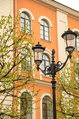 Fototapeta na wymiar Fragment of street lamps on the background of a historic house on Konyushennaya Street in St. Petersburg,