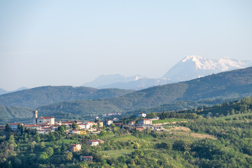Fototapeta na wymiar Small village Šmartno in Brda in Slovenia with Julian Alps