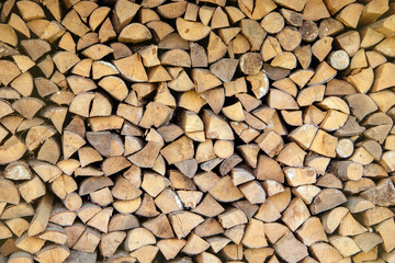 Wall firewood, Background of dry chopped firewood logs in a pile.Stack of wood for oven.