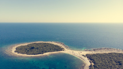 Spectacular aerial sea landscape of rocky coast and crystal clear water.