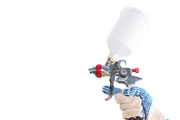 The hand of the worker with a painting gun isolated on white background.