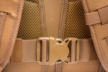 element of tactical military backpack - plastic buckle, color of coyote.  plastic buckle for tape. fastex
