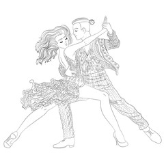 Beautifull dancing couple in a patterned outfit.