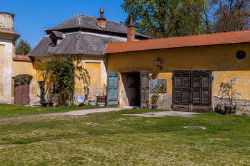 Old house with gate and flower